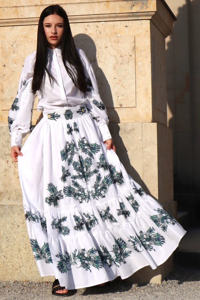 long white dress with green and blue floral pattern from the white collection