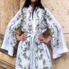 short white kimono with green and golden floral pattern
