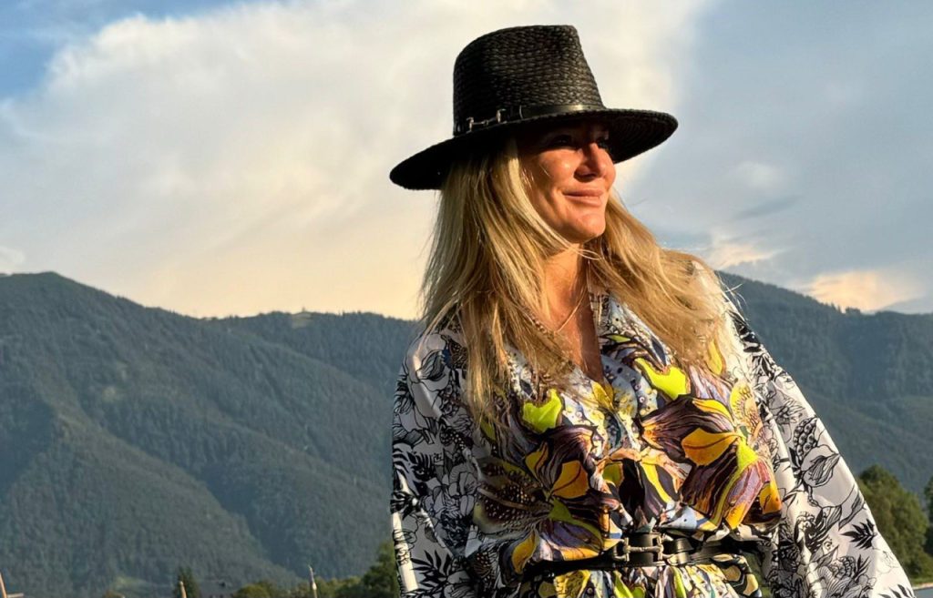 creator of barminafashion in a shirt with a hand-drawn print with mountains in the background
