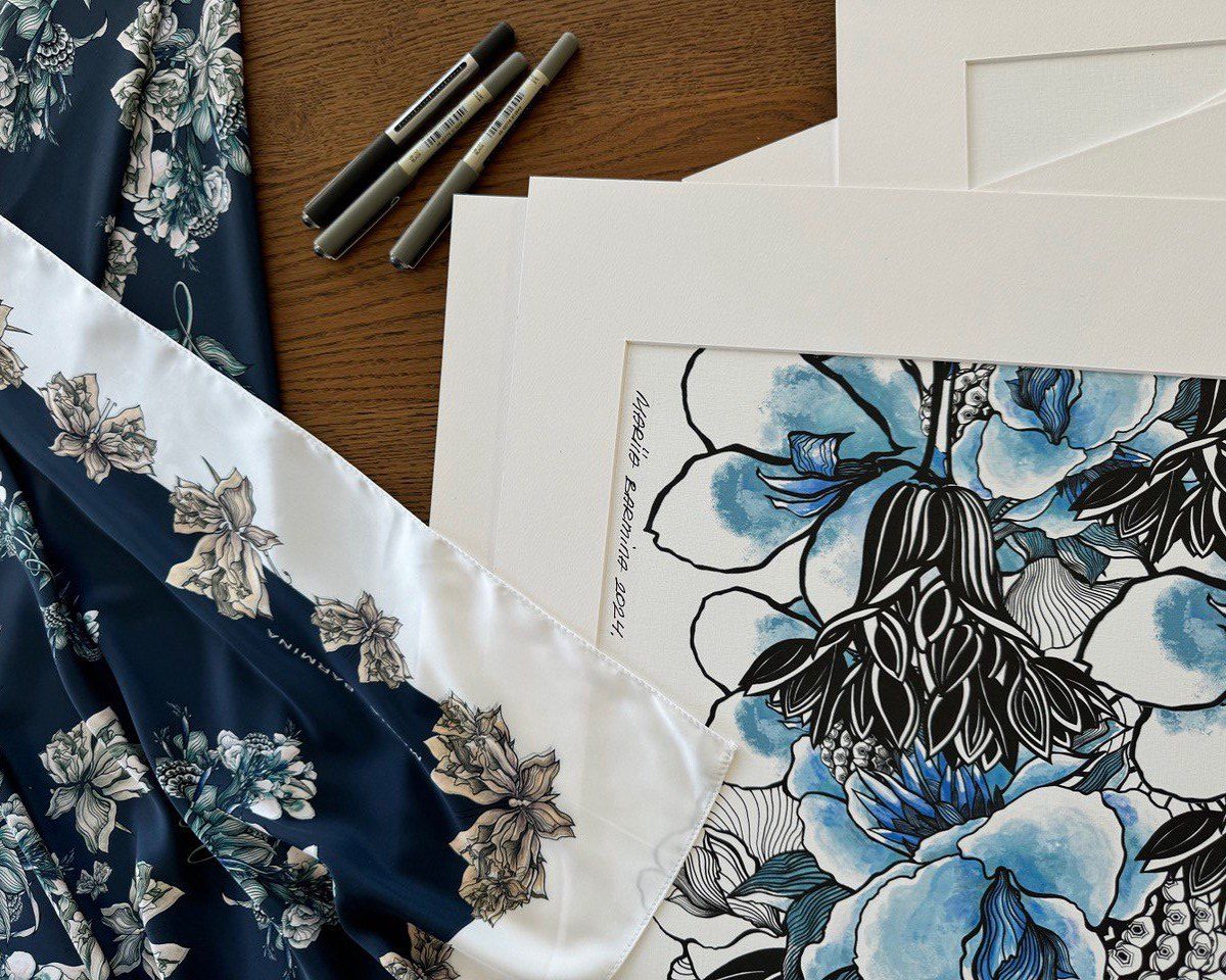 hand-painted design and a scarf on a table